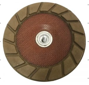 Round abrasive disc with brown surface and metal center 