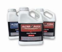 Three bottles of Ultra Z Poxy resin on a 